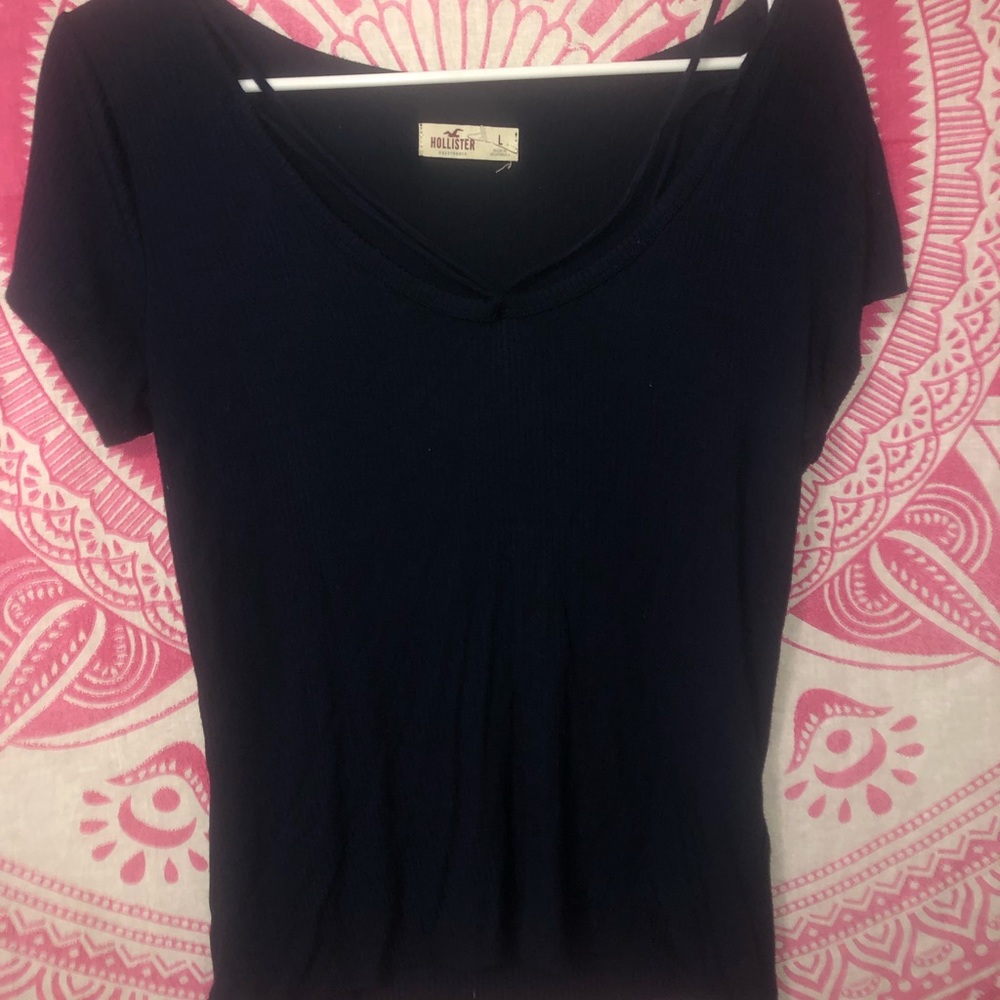 Navy blue short sleeved top with slits on top